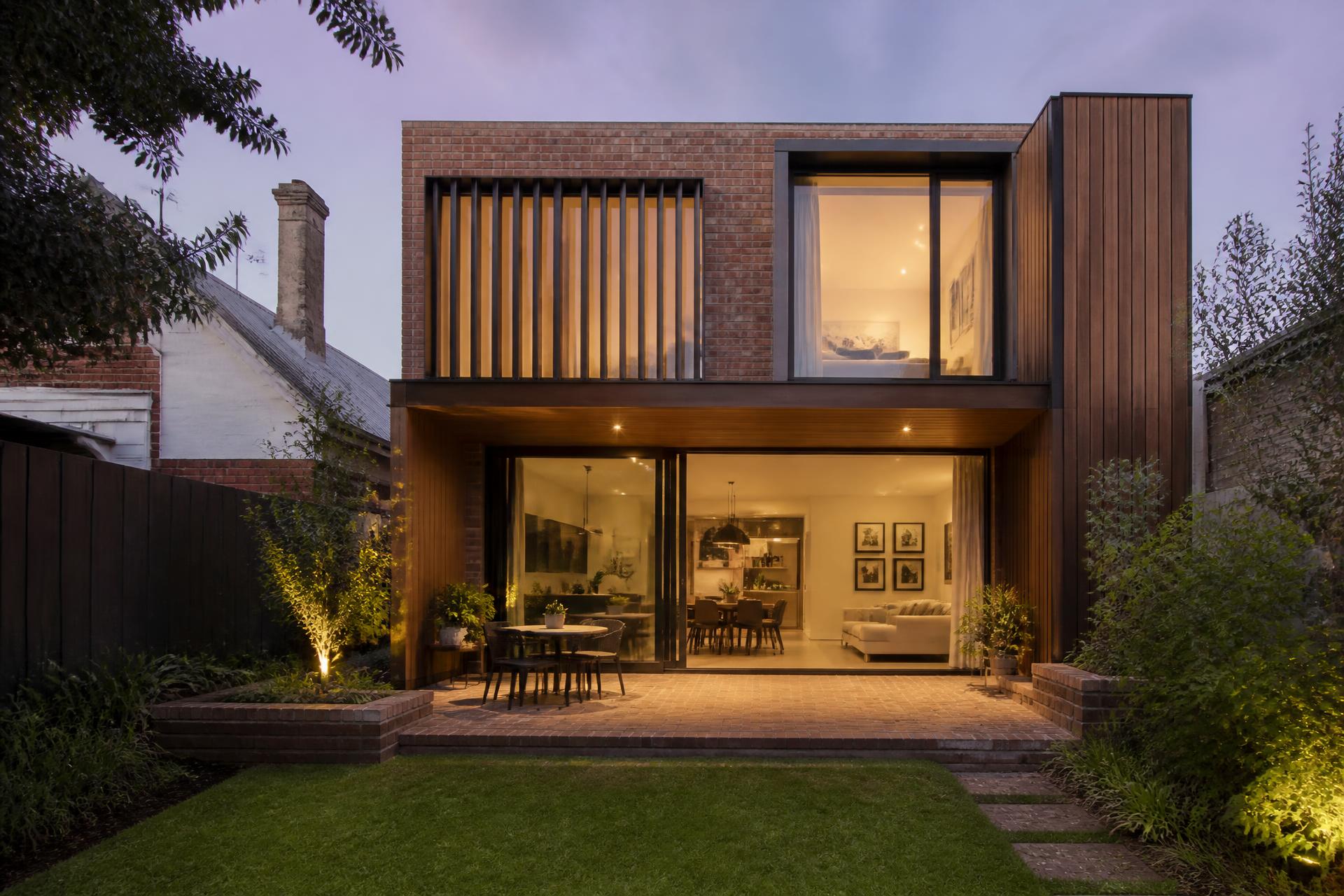 Two-storey home extension in Melbourne at dusk